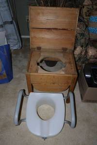 lot 45 image: Vintage wooden potty seat and plastic potty seat with handles