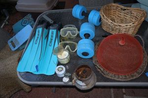 lot 253 image: Swimming flippers and goggles, citronella candles, and water exercise weights