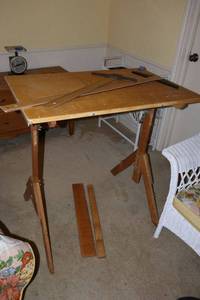 lot 209 image: Drafting table with measuring tools. Table missing a board or two. See photos