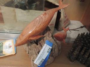 lot 976 image: Wooden WHALES on log