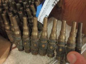 lot 977 image: BELT OF SPENT 7.92 AMMUNITION CARTRIDGES