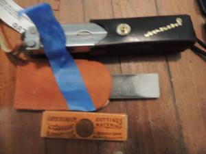 lot 988 image: LEATHERMAN IN CASE  & WHET STONE
