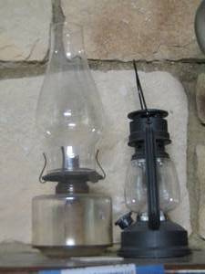 lot 114 image: black lantern and a oil lamp