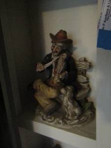 lot 227 image: man sitting on the bench playing the violin home dcor
