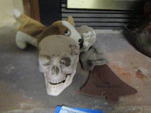 lot 207 image: stuffed dog, skull dcor, and more