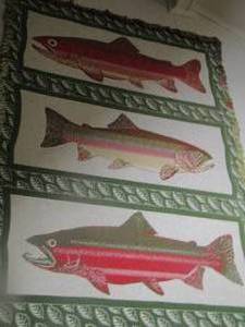 lot 49 image: fish throw blanket hanging on wall for dcor