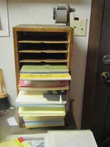 lot 643 image: paper desk organizer, with various types of paper