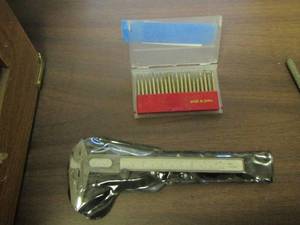 lot 679 image: small drill bit ends, small ruler