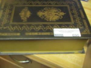 lot 690 image: black and gold hidden book empty box