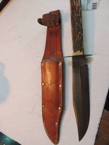 lot 4 image: JIM BOWIE KNIFE HANDMADE IN JIM BOWIE SHEATH - 12 TOTAL LENGTH,  BLADE IS 7 CARL SCHLIEPER- SOLINGEN GERMANY