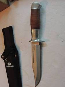 lot 878 image: mossy oak - hunting knife in canvas sheath , 5 34 blade , 10 12 lonog