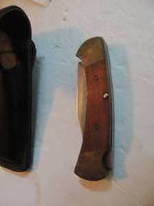 lot 962 image: Buck 112 ranger - lock back knife 420 hc steel 13 blade , 7 long leather holder