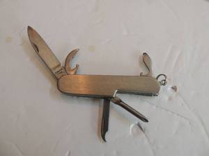 lot 701 image: 2 multi tool knives silver 2 34 red 2 14 coast