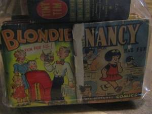 lot 929 image: qty 5 vintage comic books - porky pig, terry and the pirates, buck rogers, uncle wiggilys