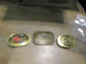 lot 897 image: Colt- windchester- belt buckles