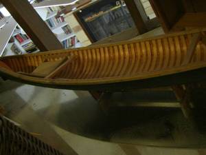 lot 1736 image: WOOD CANOE  DISPLAY