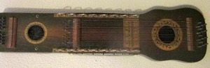 lot 1067 image: VINTAGE UKELIN -   UKELELE & VIOLIN - Combines the elements of a bowed psaltery  & a zither