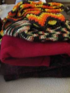 lot 1099 image: hand made throws- a few throw blankets