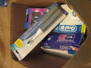 lot 1117 image: new un opened tooth paste and tooth brushes