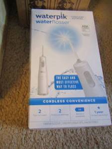 lot 1123 image: NIB cordless water pic flosser