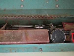 lot 1160 image: small green tool box , with misc. items see pics