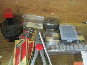 lot 1263 image: wire cutters, router bits, craftsman battery, dremal drill bits, and more