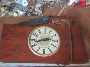lot 1274 image: piece of wood with a small clock in it
