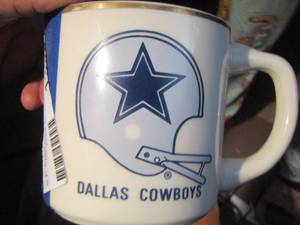 lot 1399 image: Dallas cowboy news papers - 1981  and coffee cup