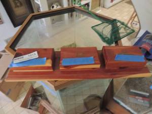lot 1012 image: WHET STONES - 3 DIFFERENT SURFACES  IN CEADR BOX WITH COVERS