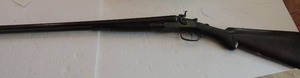 lot 1711 image: Colt P.T.   F.A.   MFG. Co. Colt model 1878 Double barrel with external hammer MFG 1878-1889  30 barrel  Scroll work on both sides