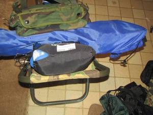 lot 1850 image: camping pillow, small crank lantern, fold up camping chair, and more