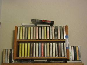 lot 1039 image: small shelf holds various CASSETTE TAPES