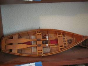 lot 1048 image: wooden dcor boat with paddles