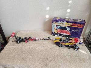 lot 16 image: Selection of diecast cars - Mad Racing Funny Car with box and a Kid Rock dragster missing a piece (piece has been glued back on)