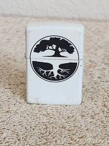 lot 114 image: White Tree of Life Zippo lighter. Hey, you know what the difference between a Zippo and a Hippo. Ones a little lighter