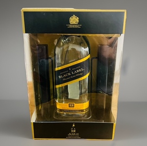 lot 12 image: Collectible Empty 12 Year Old Johnnie Walker Black Label Blended Scotch Whiskey in Customized Cradle