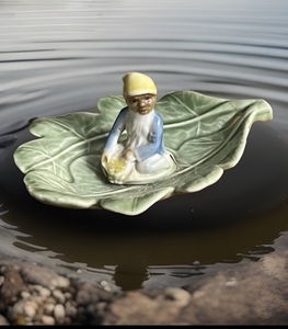 lot 83 image: Vintage LeprechaunElfPixie Floating on a Leaf by Shamrock Pottery Ireland