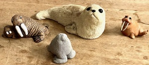 lot 85 image: Sandstone Seal Figurine Handmade Vintage TexturedSculpture, Coad Textured Momma Walrus &amp Baby, 1983 Smidgens Sea Lion, &amp Pete Apsit Holy Herd Noahs Ark Walter the Walrus Figurine&nbsp