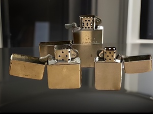 lot 94 image: Two (2) Zippo Lighters &amp One (1) Unbranded, Which Clearly States  THIS IS NOT A ZIPPO LIGHTER