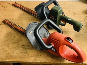 lot 124 image: Two Black &amp Decker Heavy Duty Hedge Trimmers - TR1800 Type 1 &amp HS 1000 Type 2