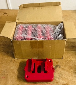 lot 151 image: Box of Battery Holders for Milwaukee, Hart, and Others