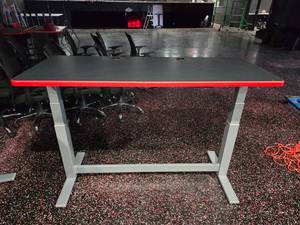 lot 54 image: Arozzi Pneumatic Adjustable Height Gaming Desk.  Top Measures 60 x 24.  Min Height 29.5 & Max Height 41