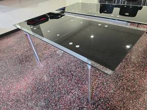 lot 120 image: Copenhagen Extendable Glass Dining Table.  Table Measures 56 x 33 x 30 Unextended (69 x 33 x 30 Exteded)