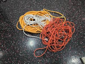lot 194 image: Lot of 3 Extension Cords.  Yellow Cord is 10AWG