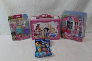 lot 34 image: 2 unopened Barbie toys and  princess metal lunchbox used and unopened pack of Disney squishies