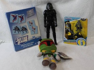 lot 56 image: Justice League matching game unopened bat man toy unopened star wars plush and a stormtrooper figure