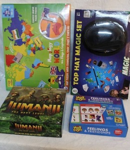 lot 85 image: all unopened games and puzzles World Map with countries and their flags and jumanji game top hat magic set and hot dot feelings and friendships
