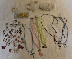 lot 86 image: lot of metal charms and jump rings and more see Pics