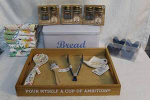 lot 90 image: Wood serving tray with a few utensils 5 packs of salt and pepper shakers and bread box and a stack of hand towels