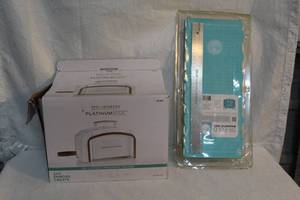 lot 99 image: Spellbinders platinum six USD a few times just didnt use much also a unused Tri-Fold Magnet Mat